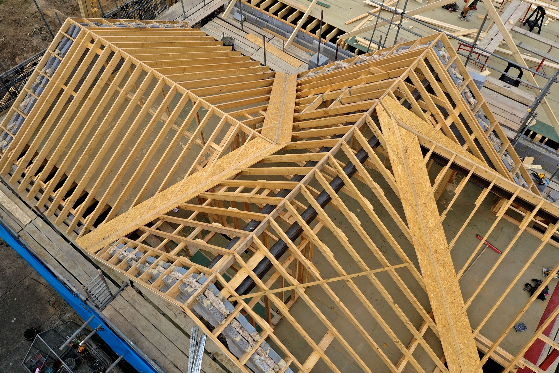 New timber roof structure being framed on a house, seen from above